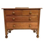 An oak chest of two short and two long drawers.