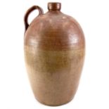 A large late 19th century stoneware bottle jar with loop handle.