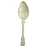 A 19th century pearlware spoon with moulded foliate scroll decoration.