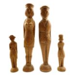 A pair of pitch pine folk art peg figures of a French sailor and a lady.