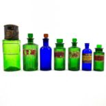 Green and blue glass apothecary bottles.
