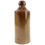 A 19th century brown saltglazed stoneware bottle.