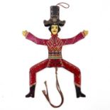 A carved and painted wood Folk Art jumping Jack automata.