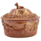A large 19th century pierced brown saltglaze tureen and cover.