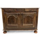 A French provincial oak buffet.