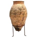 A large terracotta olive jar.