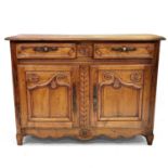 An 18th century French provincial walnut buffet.