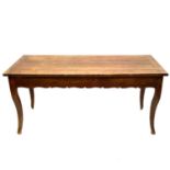 A French fruitwood farmhouse kitchen table.