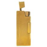 A 9ct gold Rollboy lighter by A D Bach.