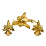 An 18ct bi-colour gold pearl set flower brooch and matching stud earrings.