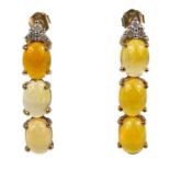 A pair of 9ct Ethiopian opal and diamond set stud earrings.