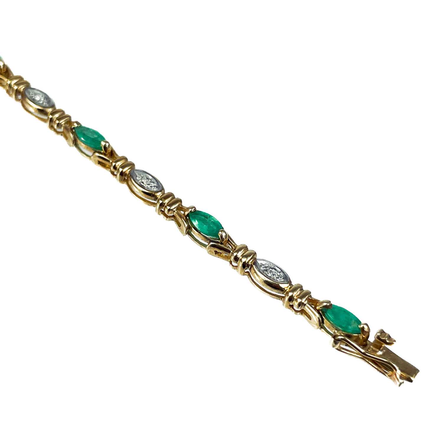 A modern 9ct gold diamond and emerald set bracelet. - Image 5 of 10