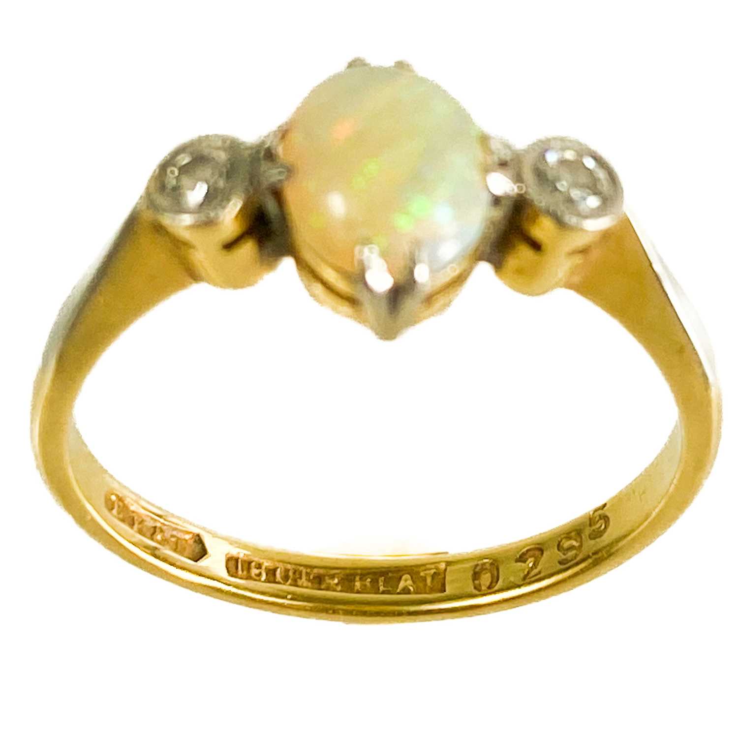 An early 20th century 18ct and platinum diamond and opal set three stone ring. - Image 2 of 4