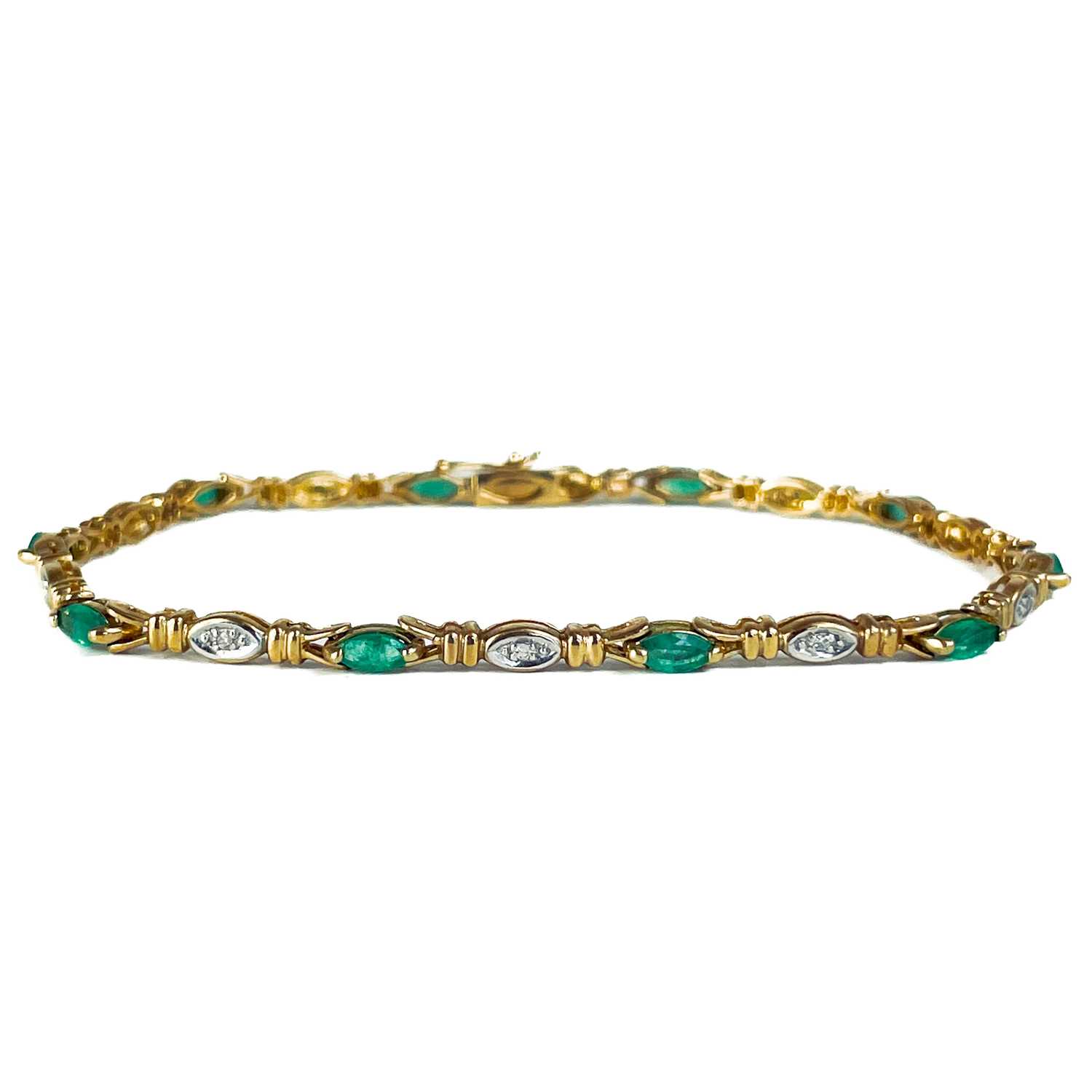 A modern 9ct gold diamond and emerald set bracelet. - Image 2 of 10