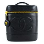 A Chanel black cavier leather vanity case.