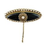 A Victorian high purity gold diamond, onyx and pearl set mourning brooch.