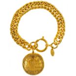 A Chanel gold tone medallion pendant bracelet.