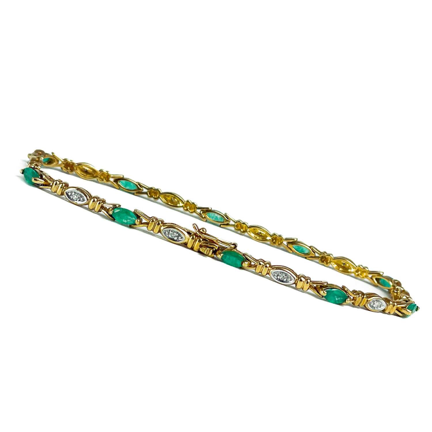 A modern 9ct gold diamond and emerald set bracelet. - Image 8 of 10