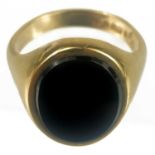 A 9ct gold onyx set gentleman's signet ring.