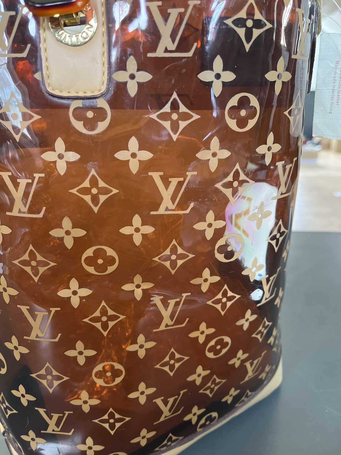 A Louis Vuitton leather and plastic shopper bag. - Image 12 of 18