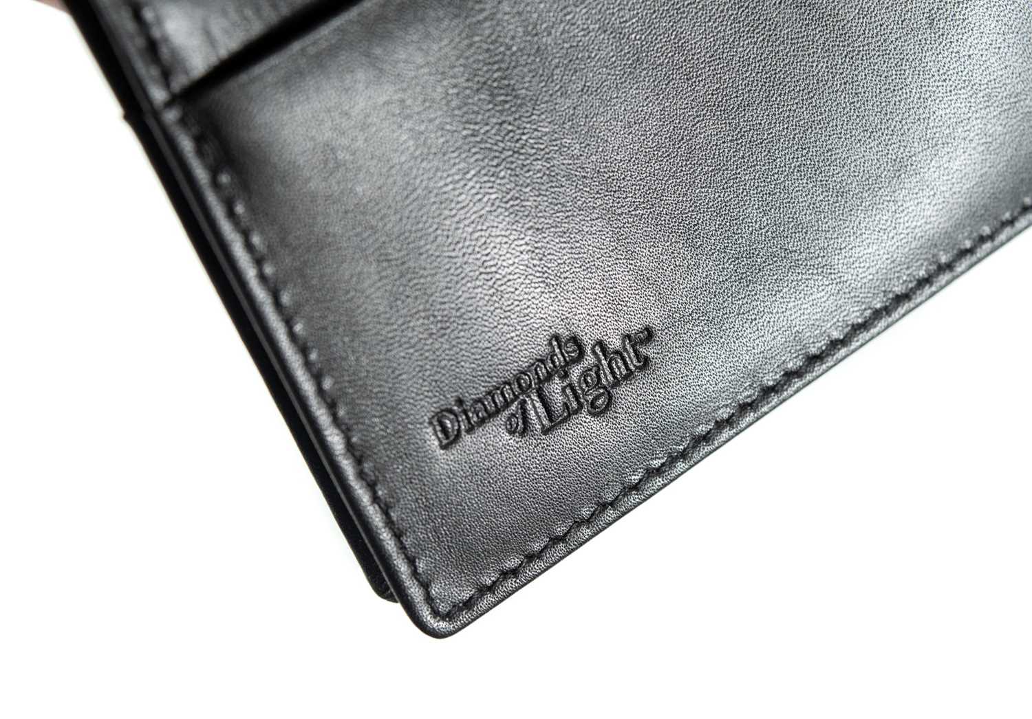 A Le Lumiere `Diamonds of Light` range black leather wallet, set with a VS diamond. - Image 5 of 7