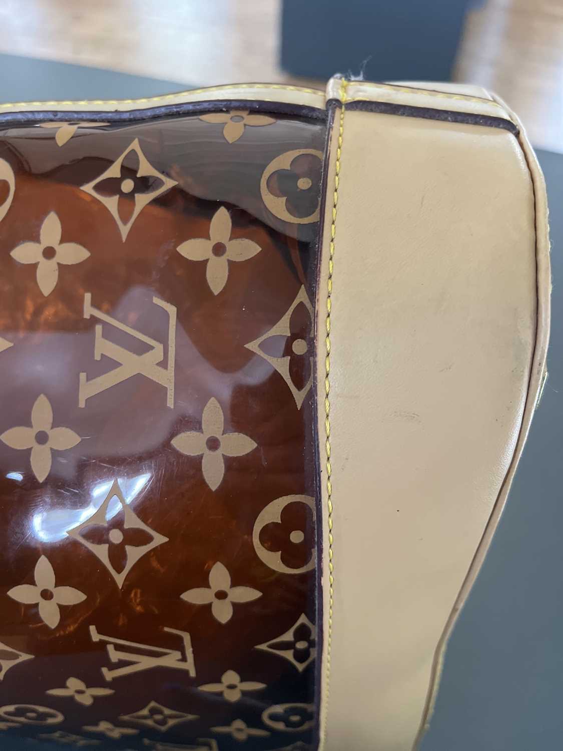 A Louis Vuitton leather and plastic shopper bag. - Image 18 of 18