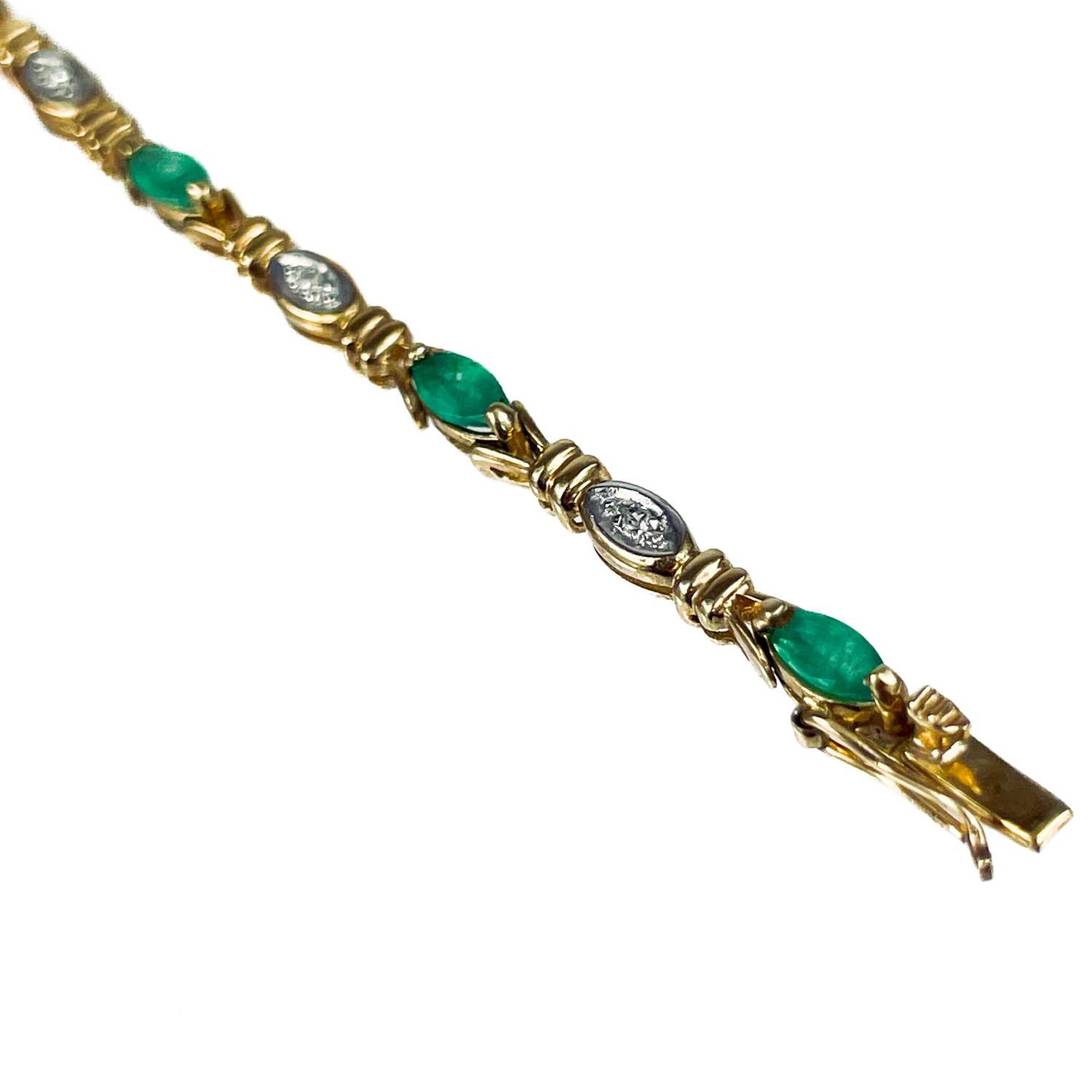 A modern 9ct gold diamond and emerald set bracelet. - Image 10 of 10