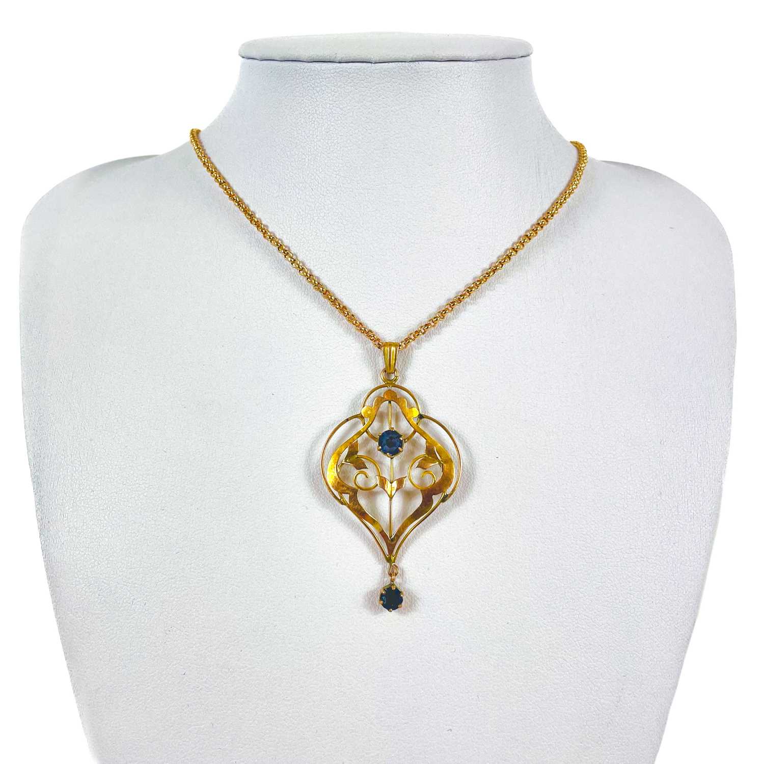 A 9ct gold Art Nouveau blue stone set pendant necklace.