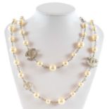 A Chanel white metal cultured pearl and white gem set CC long necklace.