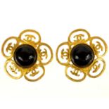 A Chanel gold tone pair of Gripoix black clover earrings.