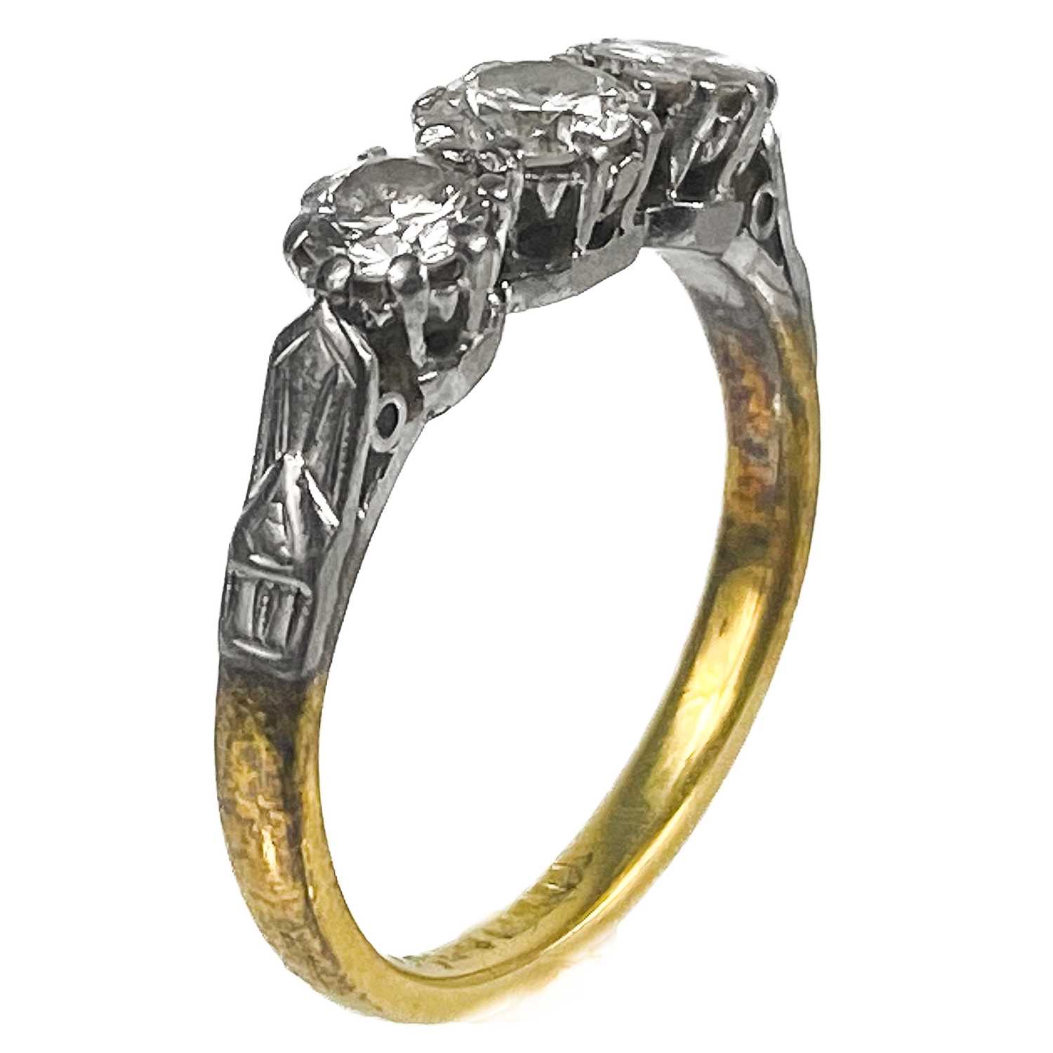 An 18ct gold and platinum diamond set three stone ring. - Image 2 of 6