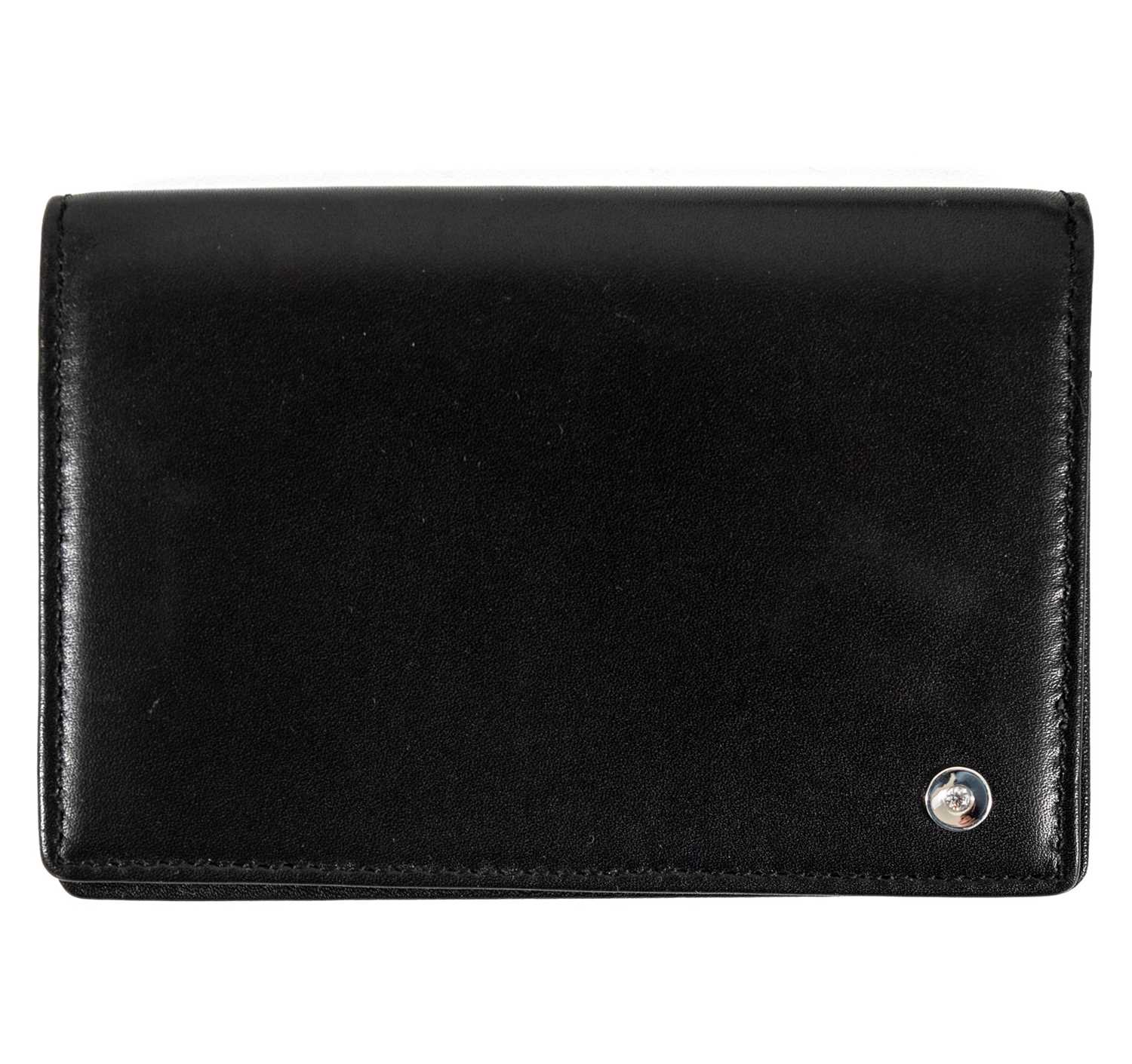 A Le Lumiere `Diamonds of Light` range black leather wallet, set with a VS diamond.