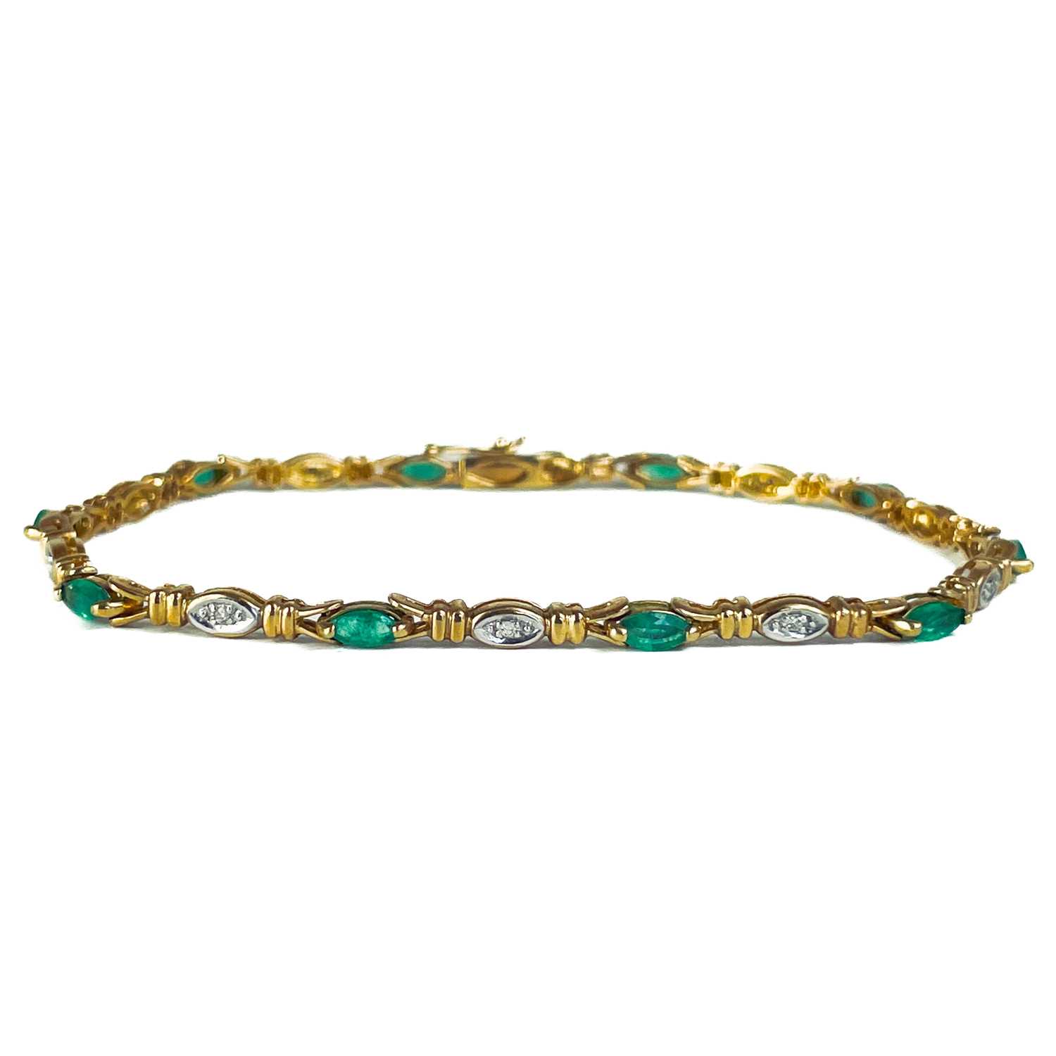 A modern 9ct gold diamond and emerald set bracelet. - Image 3 of 10