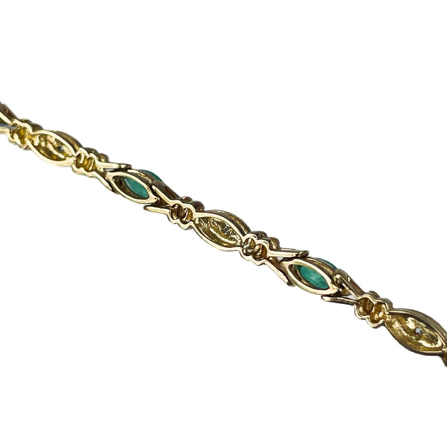 A modern 9ct gold diamond and emerald set bracelet. - Image 4 of 10