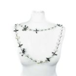 A Chanel faux pearl steel tone metal belt/necklace.