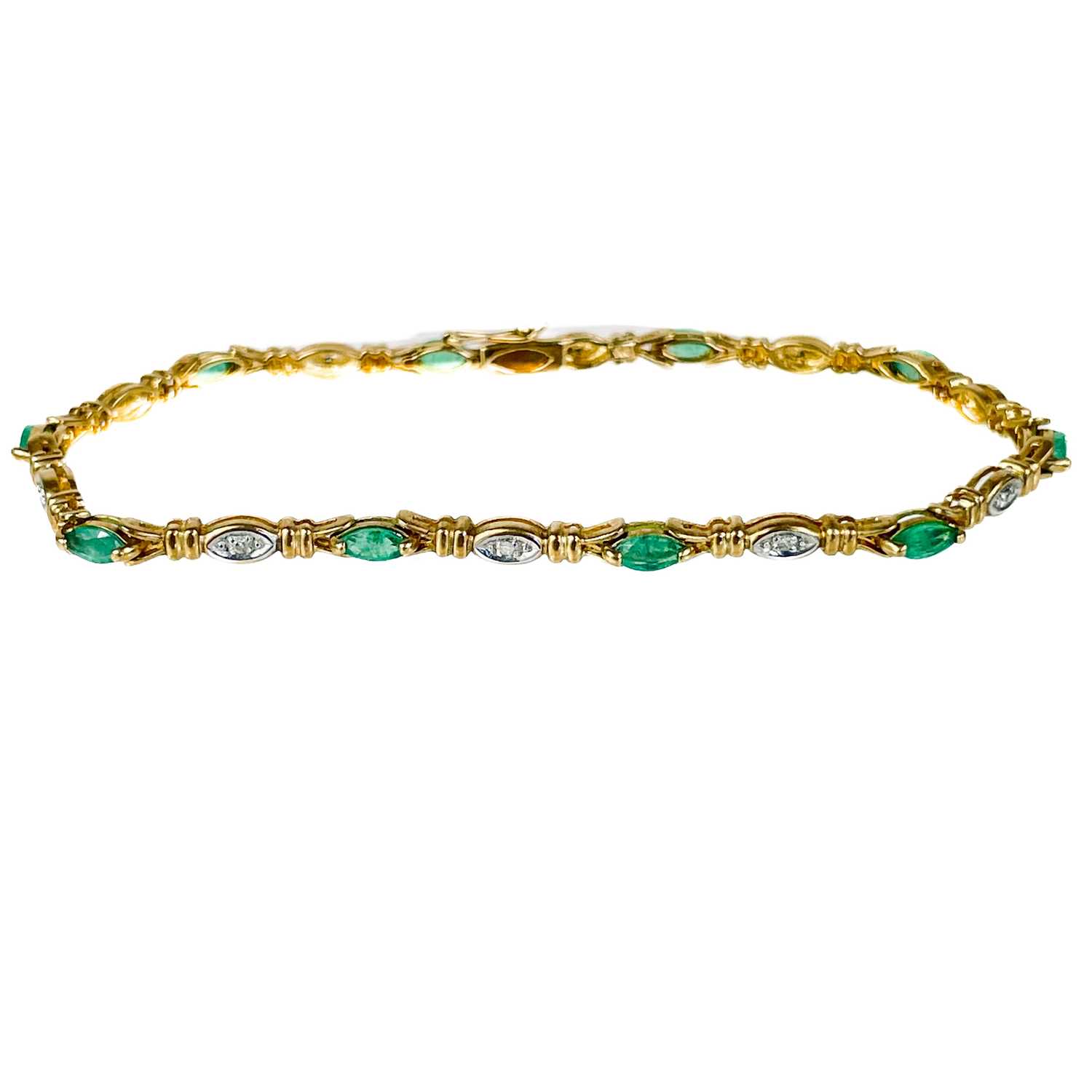 A modern 9ct gold diamond and emerald set bracelet.