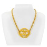 A Chanel gold tone CC pendant choker necklace.