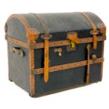 A leather and copper bound domed top trunk.