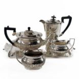 A silver plated tea set with tray, and associated coffee pot.
