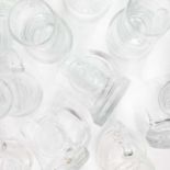 A collection of twentytwo Dartington commemorative glass tankards.