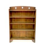A Liberty & Co Arts and Crafts oak open bookcase.