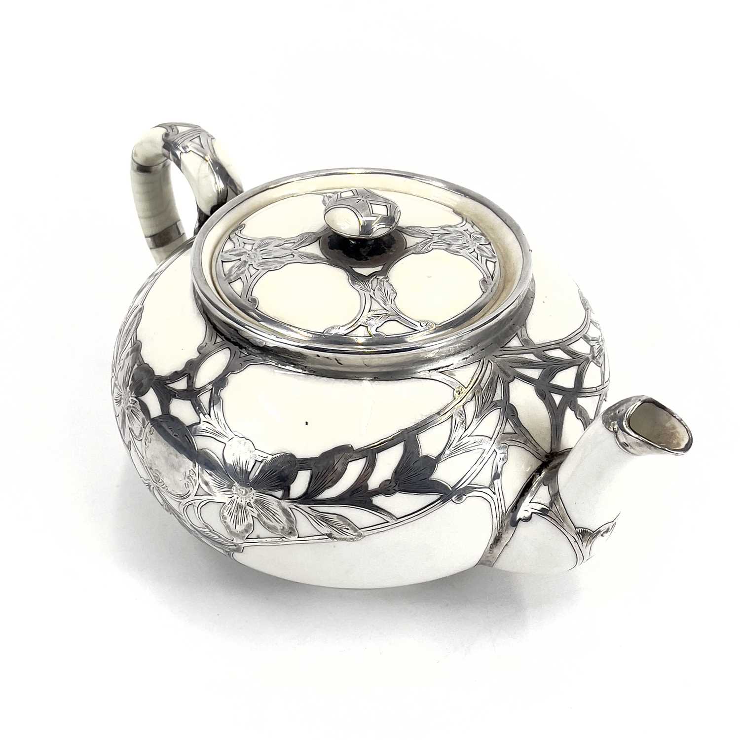 A Royal Doulton white glazed silver overlaid three-piece tea service. - Image 2 of 13