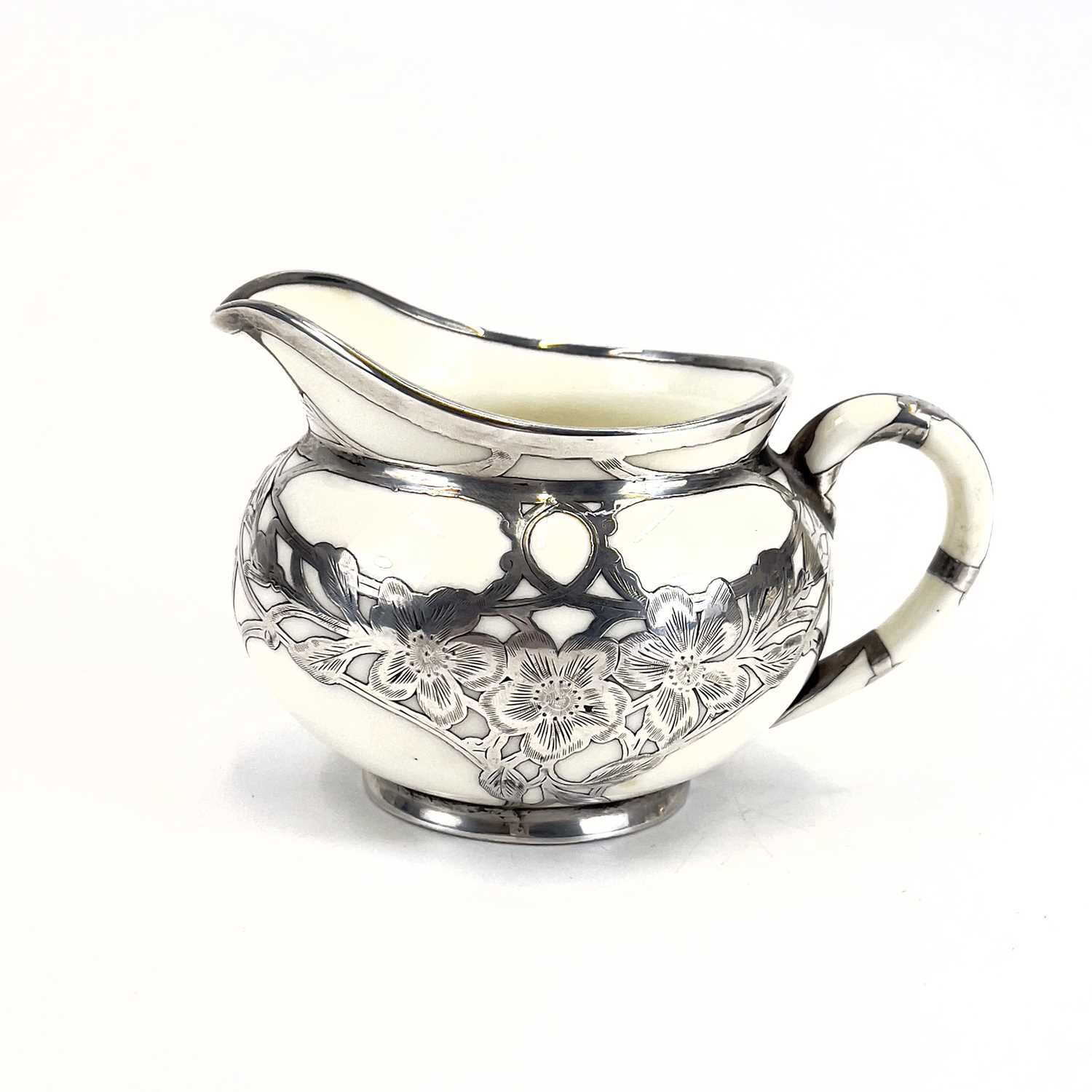 A Royal Doulton white glazed silver overlaid three-piece tea service. - Image 11 of 13