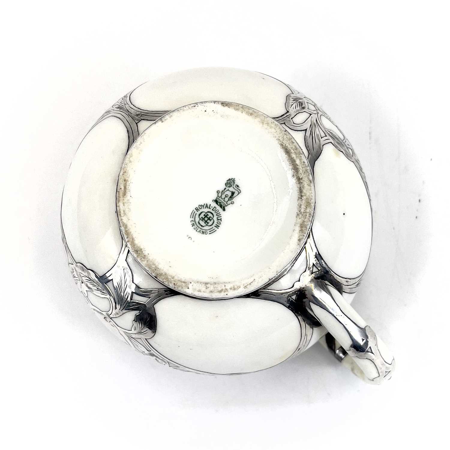 A Royal Doulton white glazed silver overlaid three-piece tea service. - Image 8 of 13