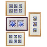 A pair of Dutch delft manganese tiles in a frame.