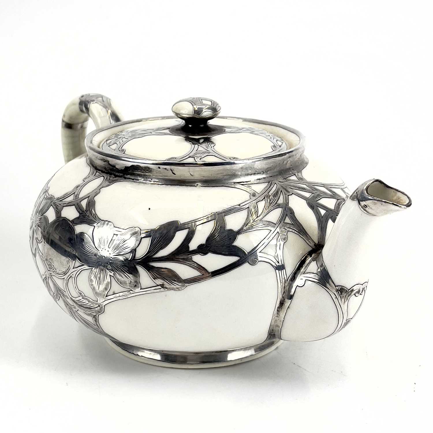 A Royal Doulton white glazed silver overlaid three-piece tea service. - Image 3 of 13