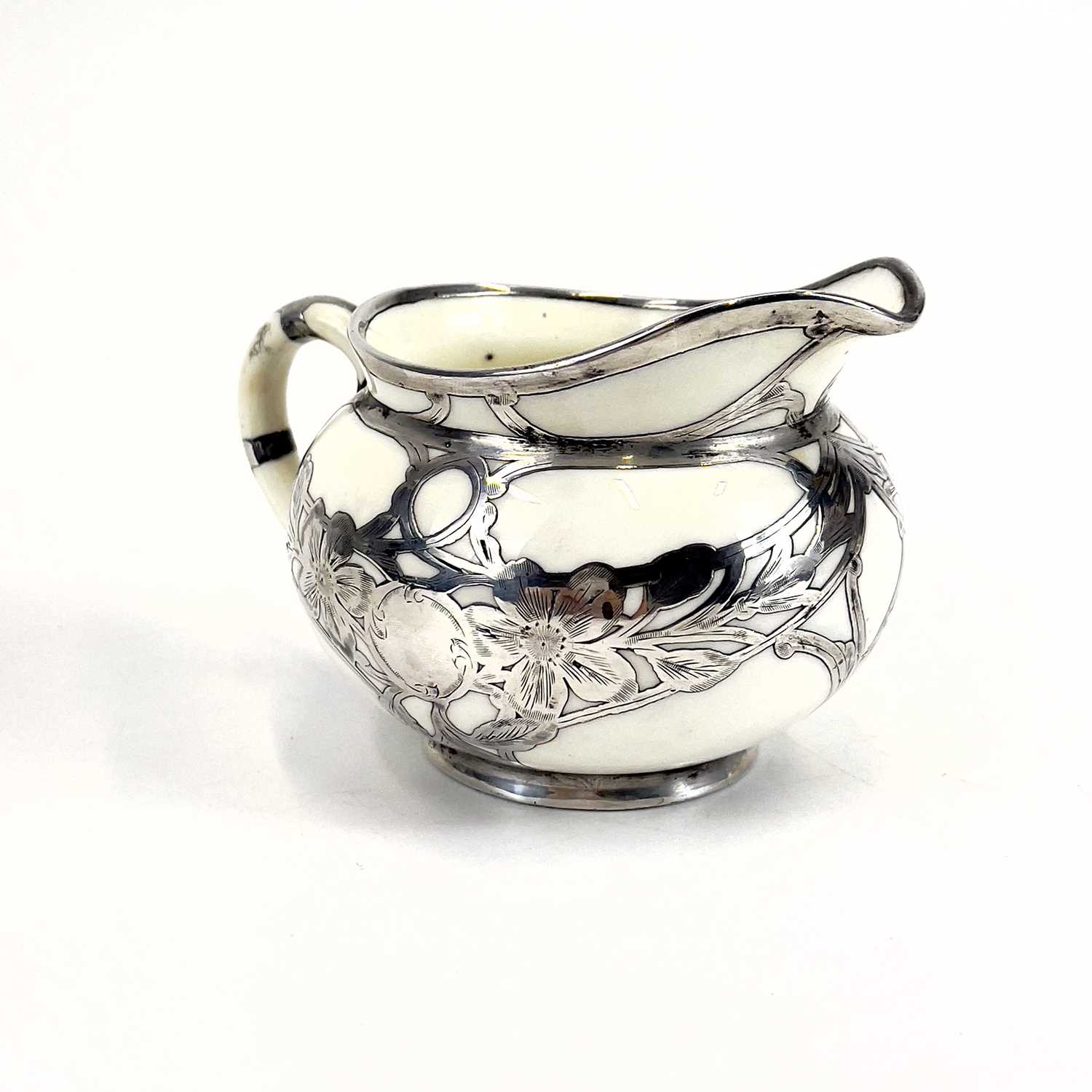 A Royal Doulton white glazed silver overlaid three-piece tea service. - Image 7 of 13