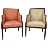 A matched pair of Regency upholstered armchairs.