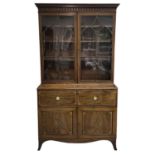 A George III mahogany and satinwood banded secretaire bookcase.
