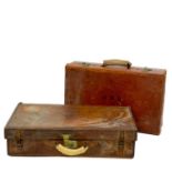 An early 20th century leather suitcase.